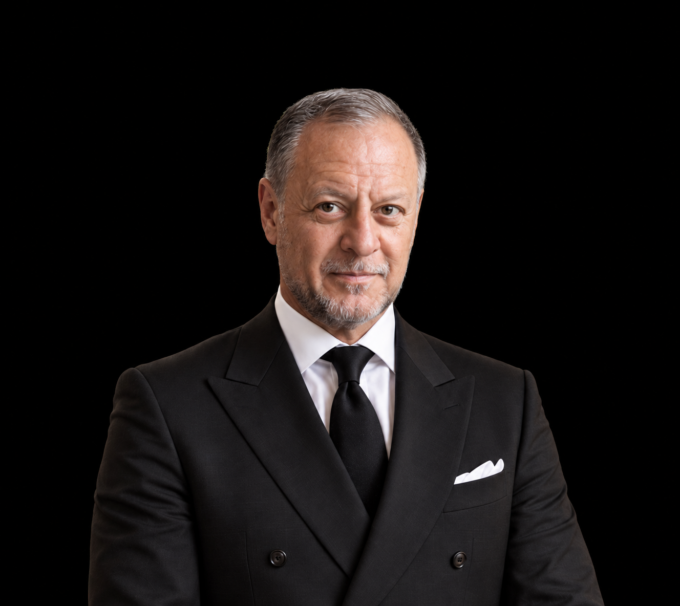 Portrait of Nadahl Shocair in a black suit